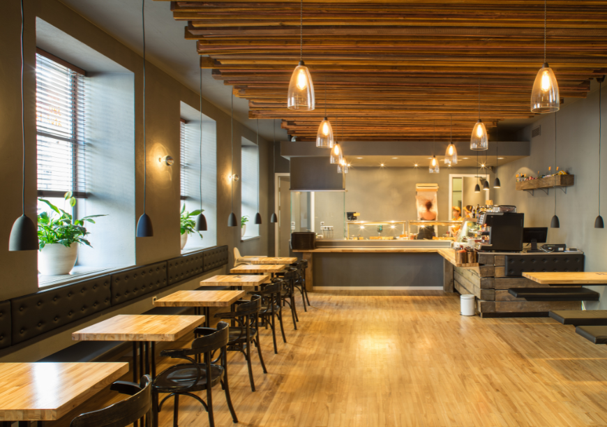 Restaurant interior with acoustic baffles and wall art